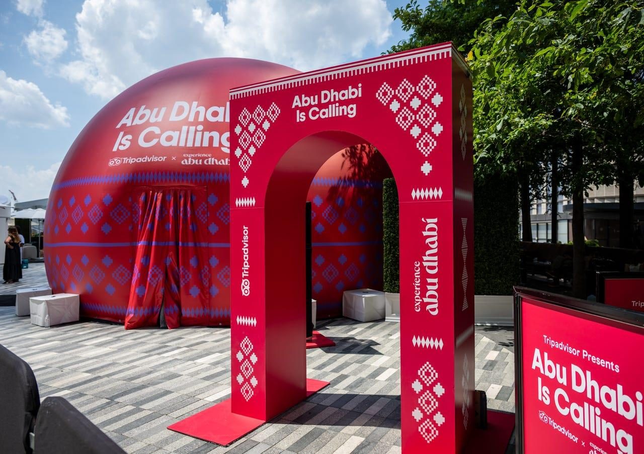 Abu Dhabi Is Calling red arch and dome at a Tripadvisor event