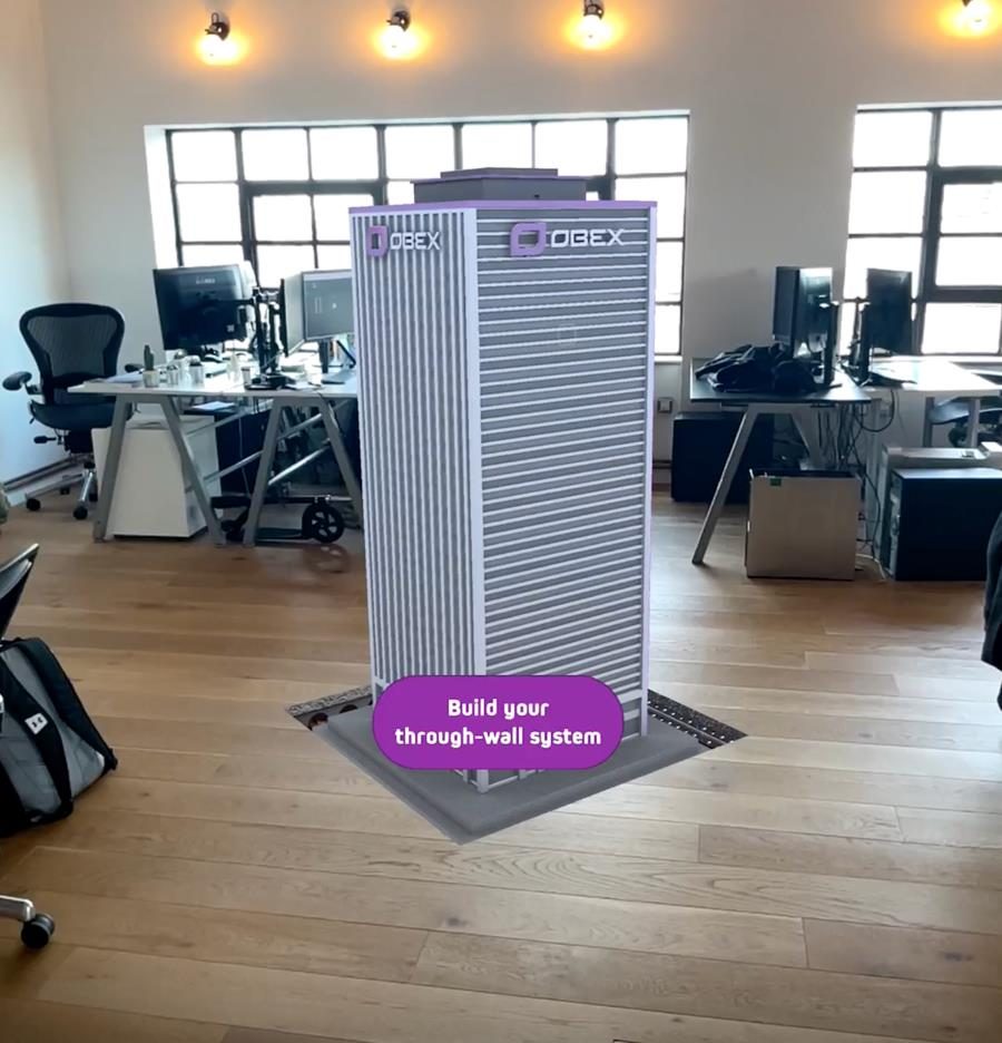 A building rising from the floor in AR with a Build your through-wall system button