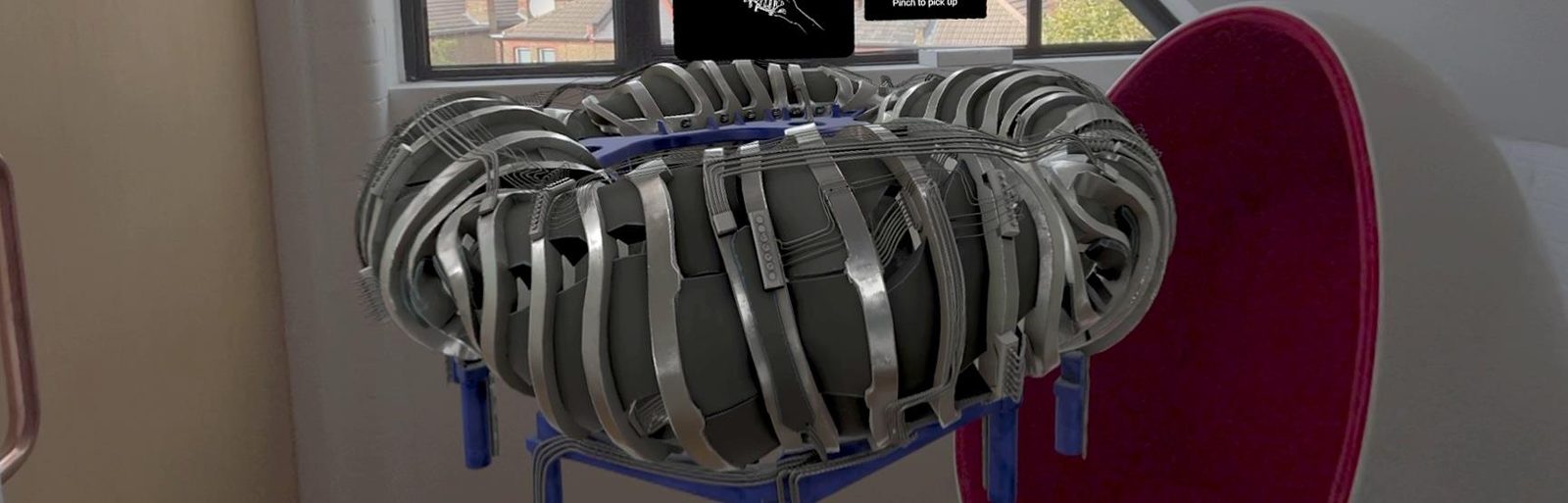 Proxima Fusion stellarator reactor shown in mixed reality in a room